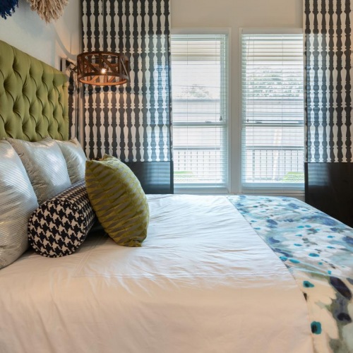 Generous bedroom offerings to fit every family a bed with a white bed spread