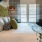 a bed with a white bed spread