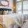 a bedroom with a bed and lamps