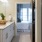 a bathroom with a bed and sink