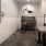 a bathroom with a table and a mirror