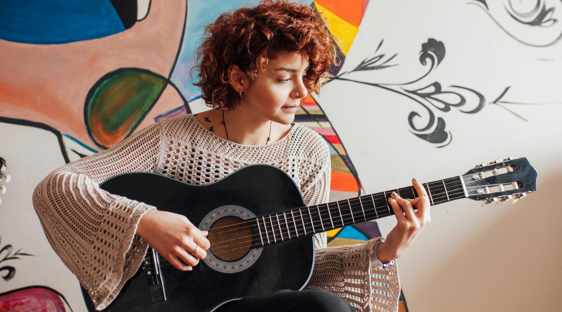 Lifestyle Woman playing guitar