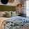 a bedroom with a bed and a mirror