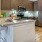 a kitchen with a stainless steel refrigerator