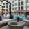 a patio with a couch and chairs