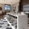 a kitchen with a bar and chairs