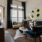 a living room with a fan and couches