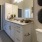 a bathroom with a countertop sink and a mirror
